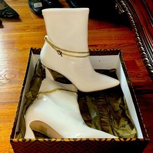 Charles David White heeled boot with gold chain